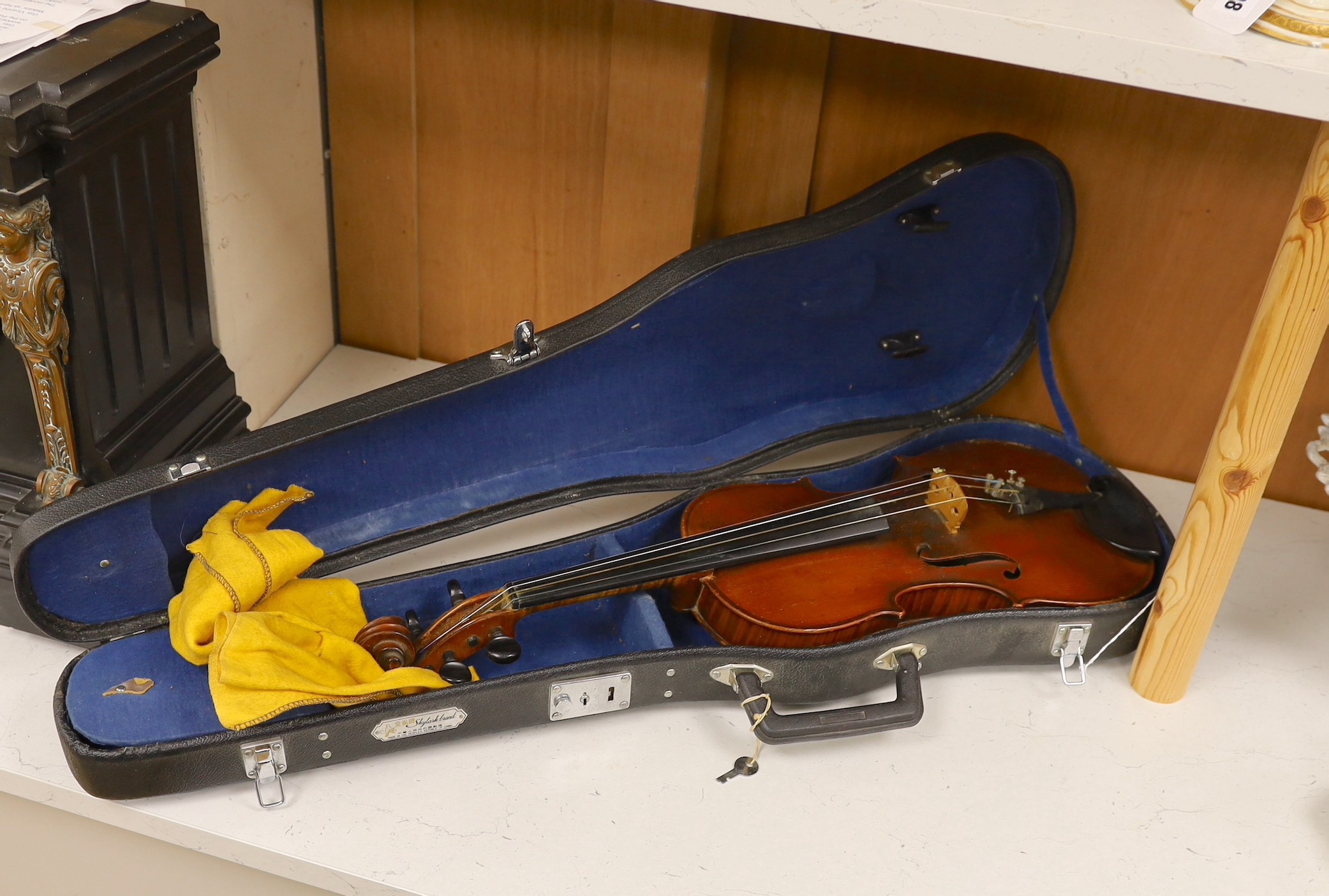 A cased French double backed violin, interior label reads ‘Copie de J.B. Vuillaume à Paris.’ Back measures 36cm excluding button